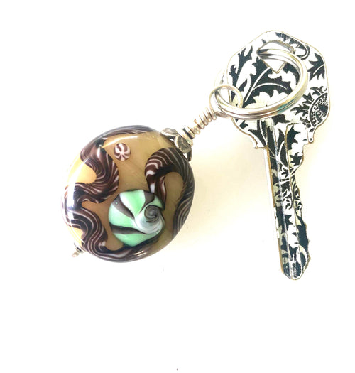 Lamp Work Key Ring With Yellow Pouch.