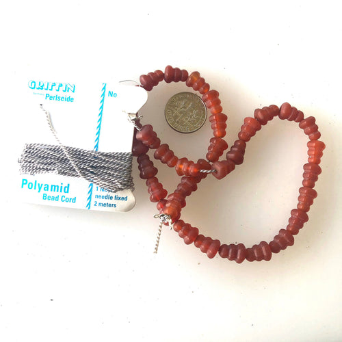 Afghani Hand Carved Agate Bead Necklace to finish
