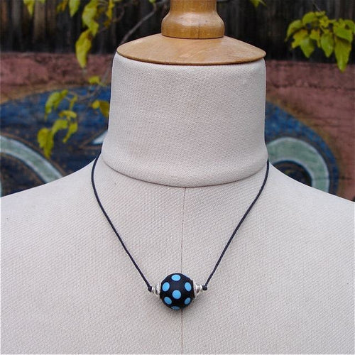 Lampwork Matte Glass Black Bead With Turquoise Dots and Silver on two knot cord