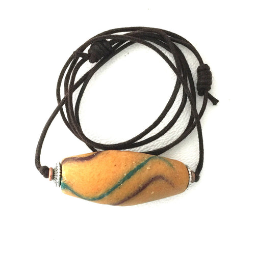 Antique yellow Akoso Ghanaian powdered glass bead accented with colorful trail  Perfect Condition Necklace on Two Knot Cord.